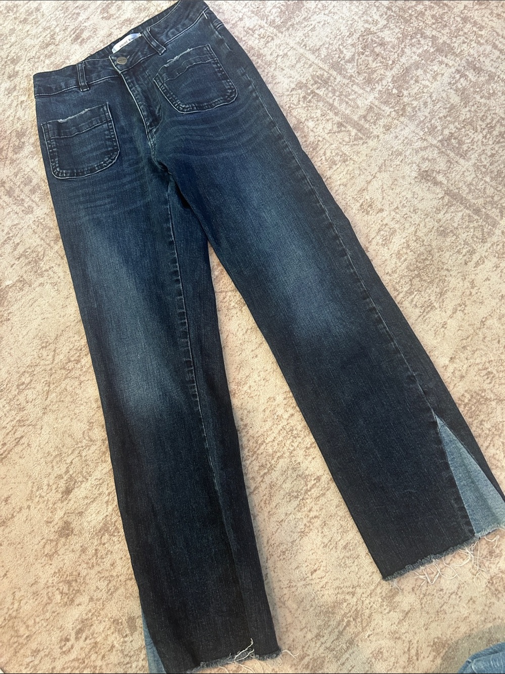 Anine Bing dark wash cropped denim jeans feature distinctive front patch pockets
